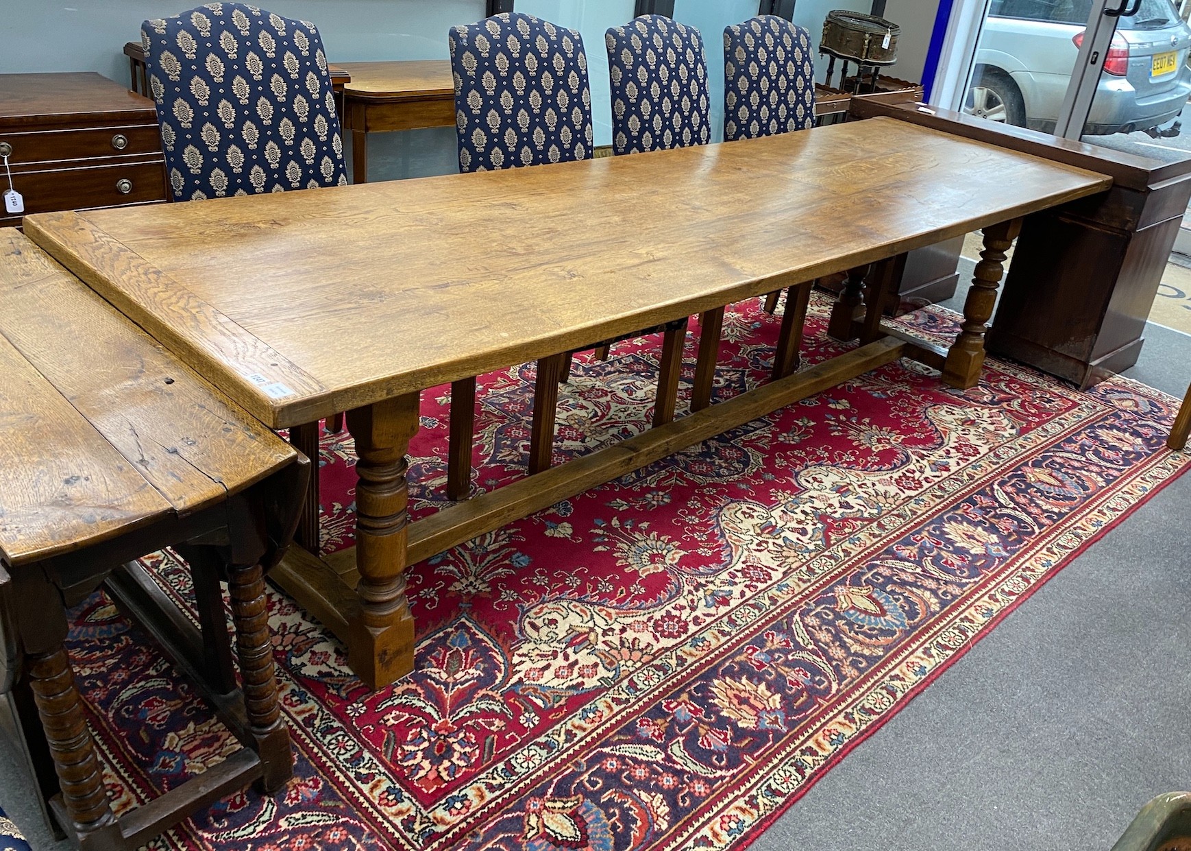 A large 18th century style rectangular oak refectory dining table, length 296cm, depth 89cm, height 76cm